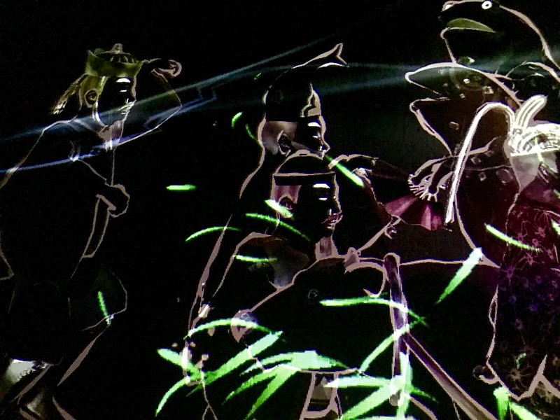 Musicians in a parade collide with fish as they enter this space.