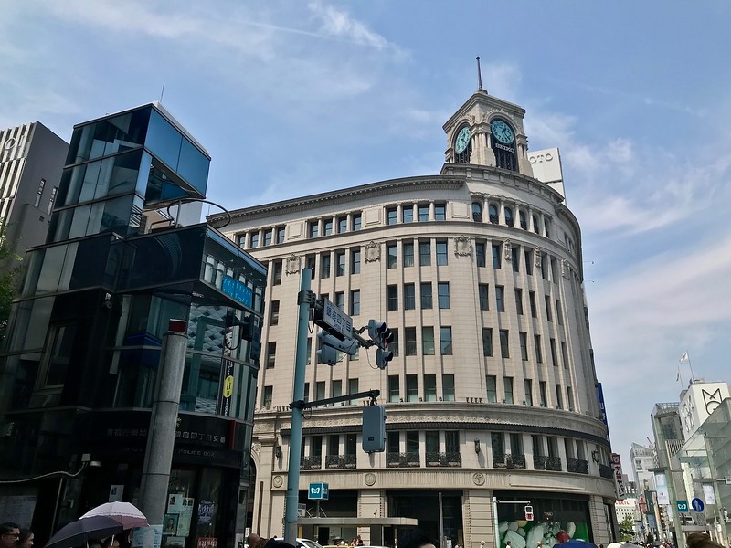 The curved exterior of one of the main buildings on Tokyo’s Harumi-dori Street on a clear day