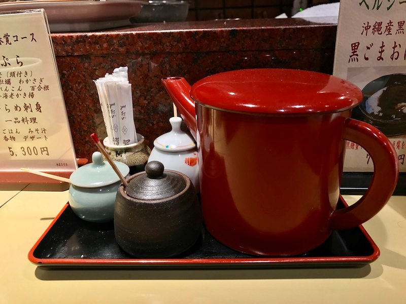 The red jug contains tentsuyu, and the rest of the small pots contain various salts.