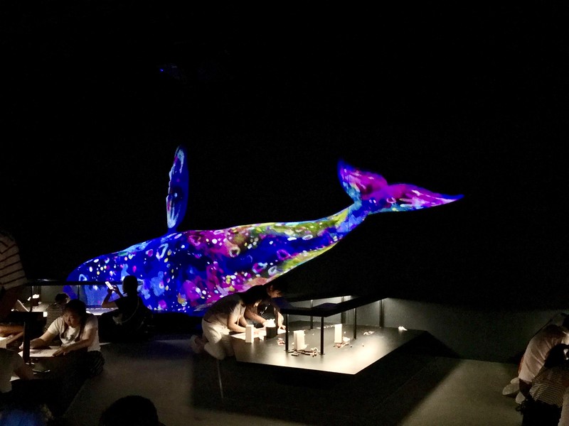 Participants drawing their own animals that become part of the digital artworks in the Future Park zone.