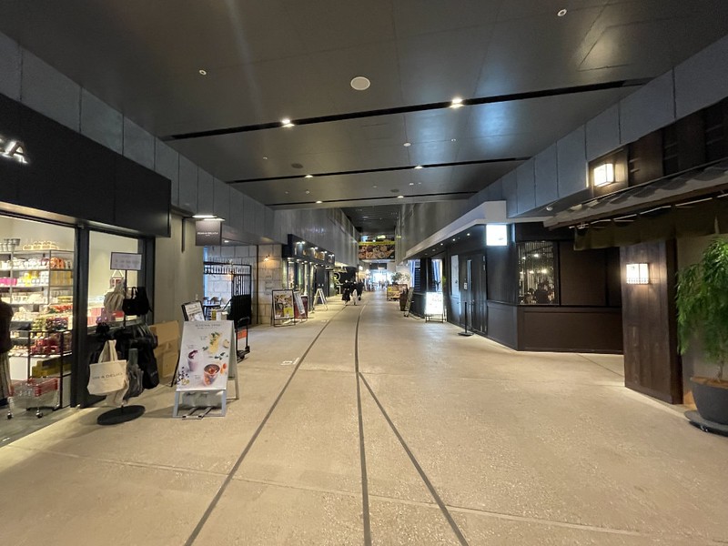 Interior walkway leading to restaurants and food shops in the Shibuya Stream entertainment complex in Tokyo, Japan