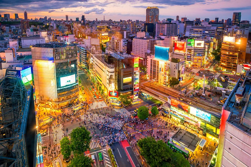Neon-lit Shibuya Crossing seen from above at twilight in Tokyo, Japan Neon-lit Shibuya Crossing seen from above at twilight in Tokyo, Japan
