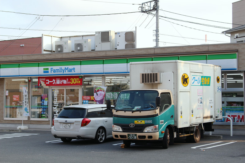 Yamoto truck outside a convenience store. Editorial credit: Ned Snowman / Shutterstock.com
