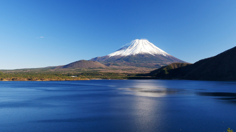 Mt Fuji rising over Lake Motsu. Editorial credit: Arata Matsumoto / Shutterstock.com