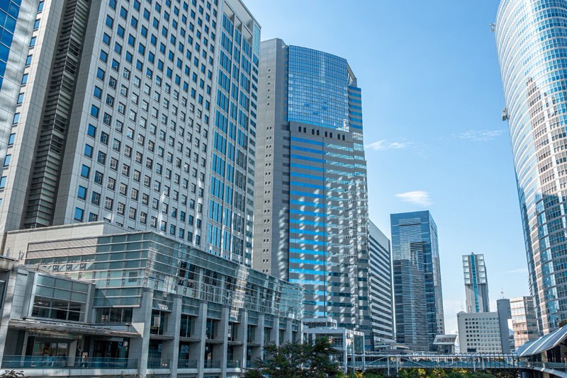 Large office buildings in front of Shinagawa Station in Tokyo on a sunny day