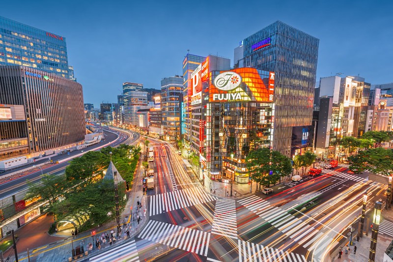 Timelapse image of streets and neon-lit buildings in the Ginza district of Tokyo at night Timelapse image of streets and neon-lit buildings in the Ginza district of Tokyo at night