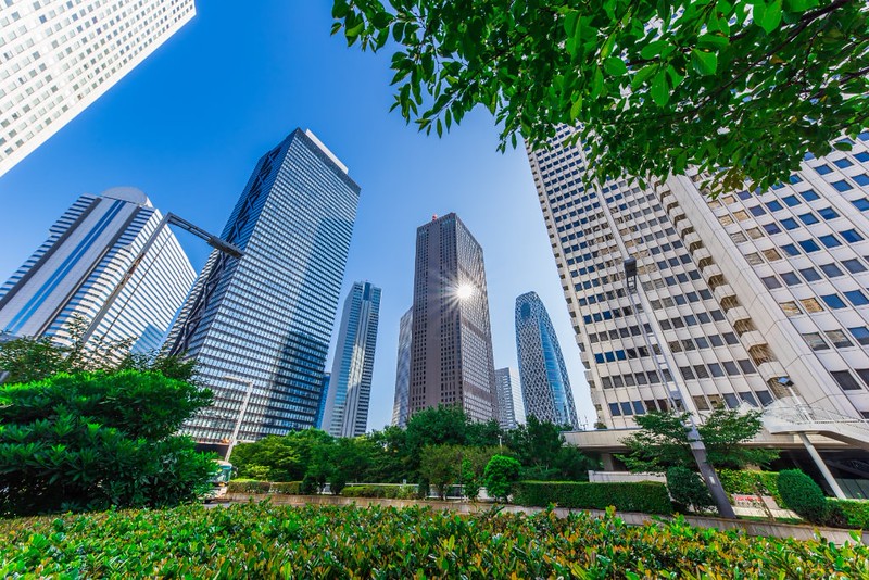 A view of multiple high-rise buildings in West Shinjuku, Tokyo on a sunny day A view of multiple high-rise buildings in West Shinjuku, Tokyo on a sunny day