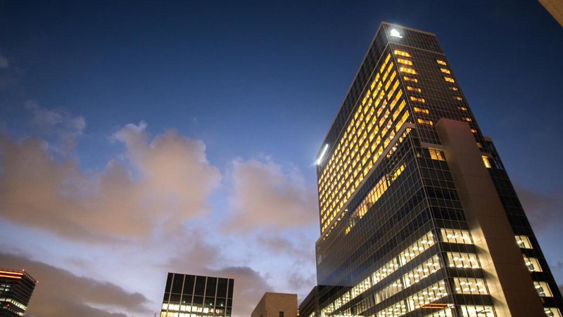 Night view looking up at the illuminated tower of The Blossom Hibiya hotel in Tokyo Night view looking up at the illuminated tower of The Blossom Hibiya hotel in Tokyo