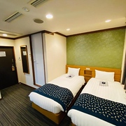 Twin beds in a Touganeya Hotel double room, Tokyo, Japan