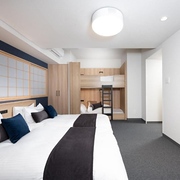 Mimaru Shinjuku West hotel in Tokyo family room with two sets of twin beds and wooden bunk beds