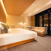 Traditional Japanese-style tatami sleeping area for four with low table in a Karaska hotel family room in Tokyo, Japan