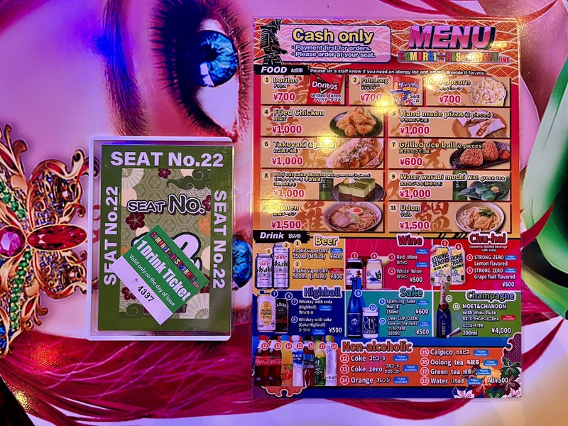 A menu, drinks ticket, and seat reservation at Samurai Restaurant Time