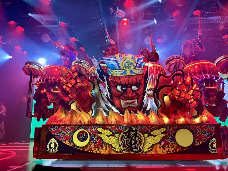 A traditional red Japanese float with taiko drummers at Samurai Restaurant Time