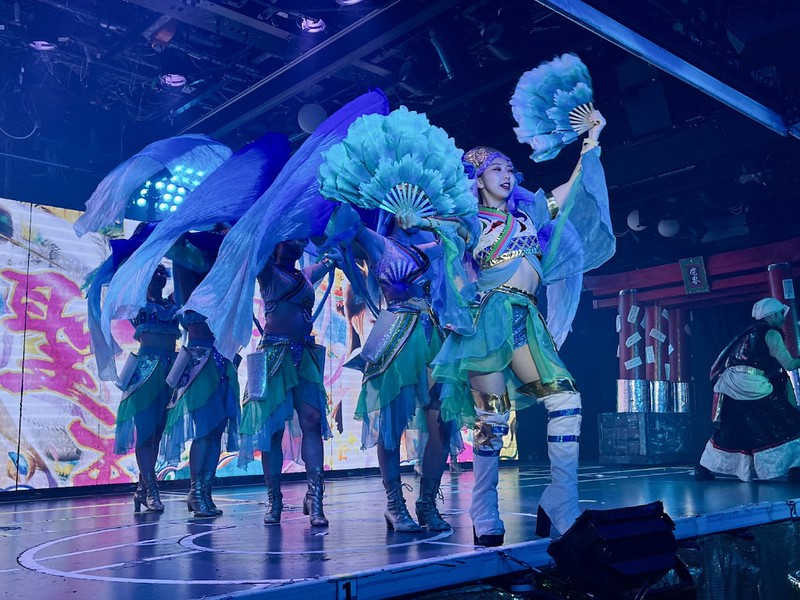 Dancers at Samurai Restaurant Time holding fans and wearing thigh-high boots