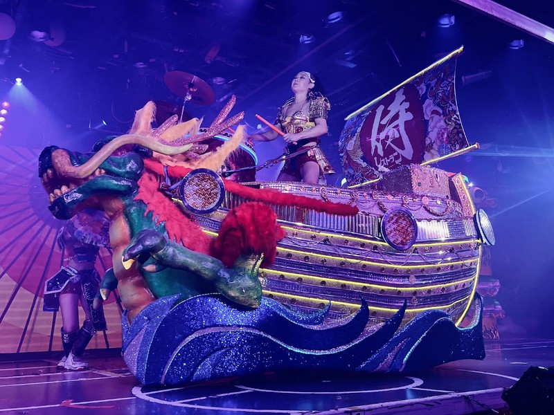 A giant mechanised float in the shape of treasure ships with a taiko drummer onboard