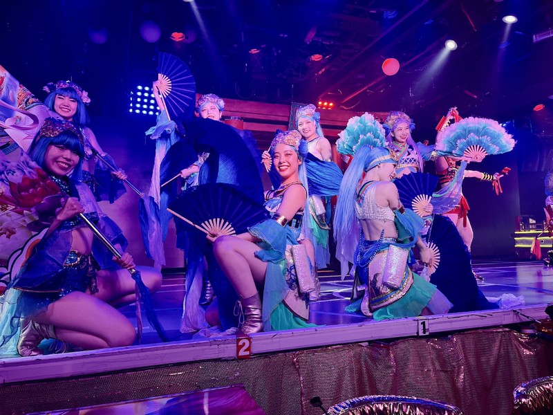 Cabaret dancers at Samurai Restaurant Time with fans and rainbow-coloured wigs