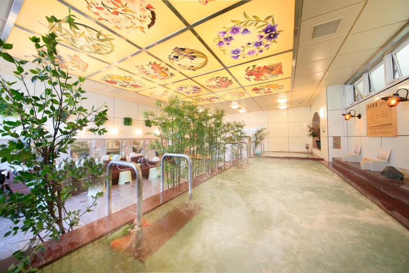 The large bathing area with floral ceiling in the Ueno Station Hostel Oriental II capsule hotel, Tokyo